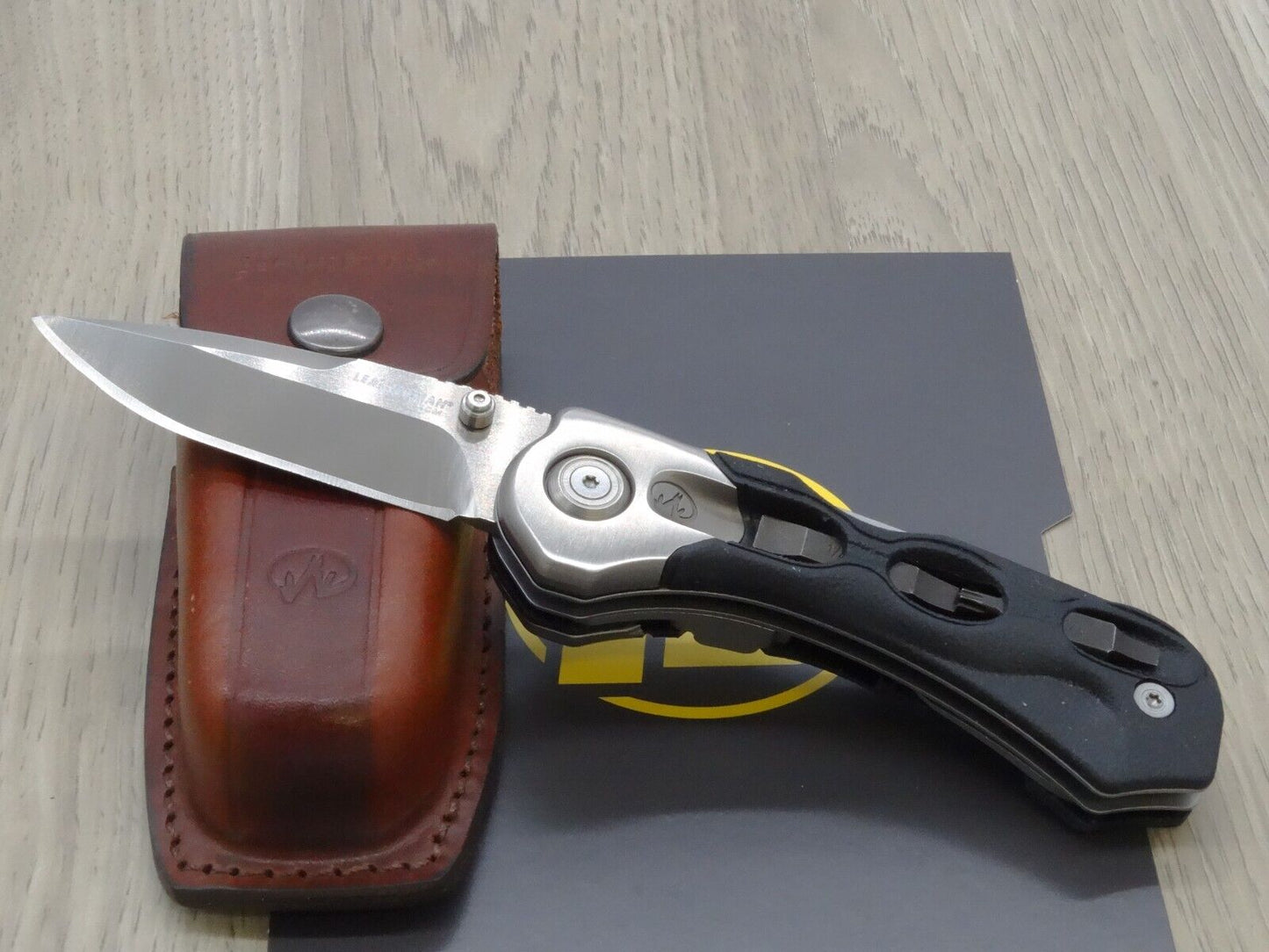 Leatherman folding knife K502X with Leather Sheath Retired Collectors Item